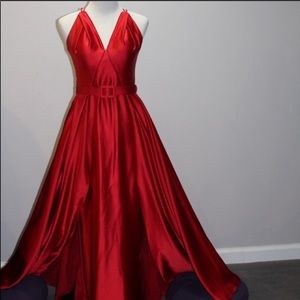 Fitted red satin dress with attached overskirt